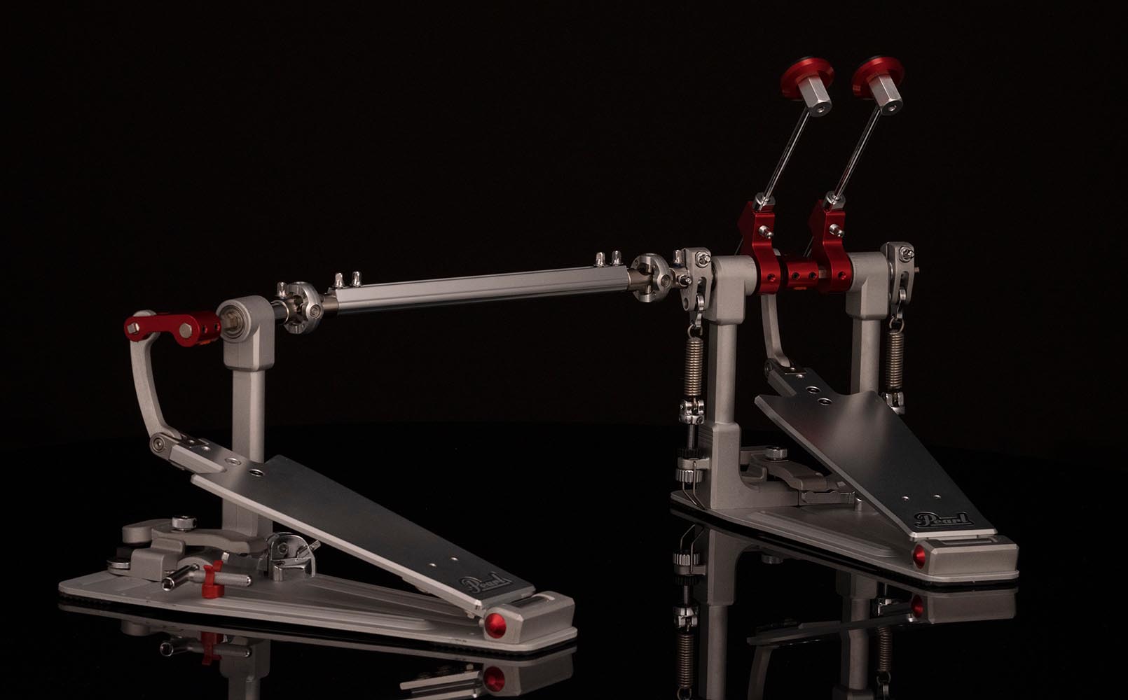 Pearl Demon XR direct-drive double bass drum pedal with machined aluminum longboard footboards, dual XR beaters, and Z-Link drive shaft for high-speed double kick drumming.