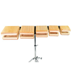 Grover Pro Protégé Temple Block Set with five graduated wood blocks mounted on a black bar, front view on a chrome stand