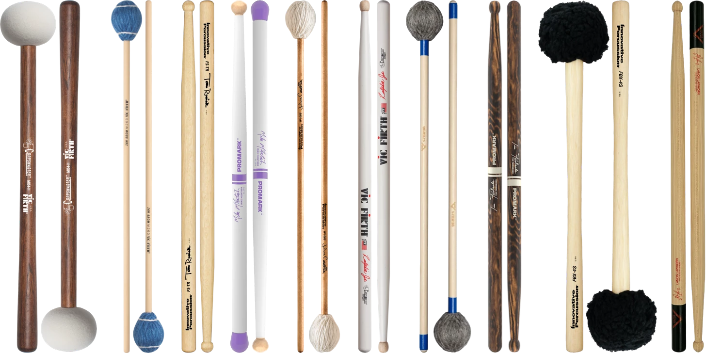 Various pairs of marching drumsticks and mallets.